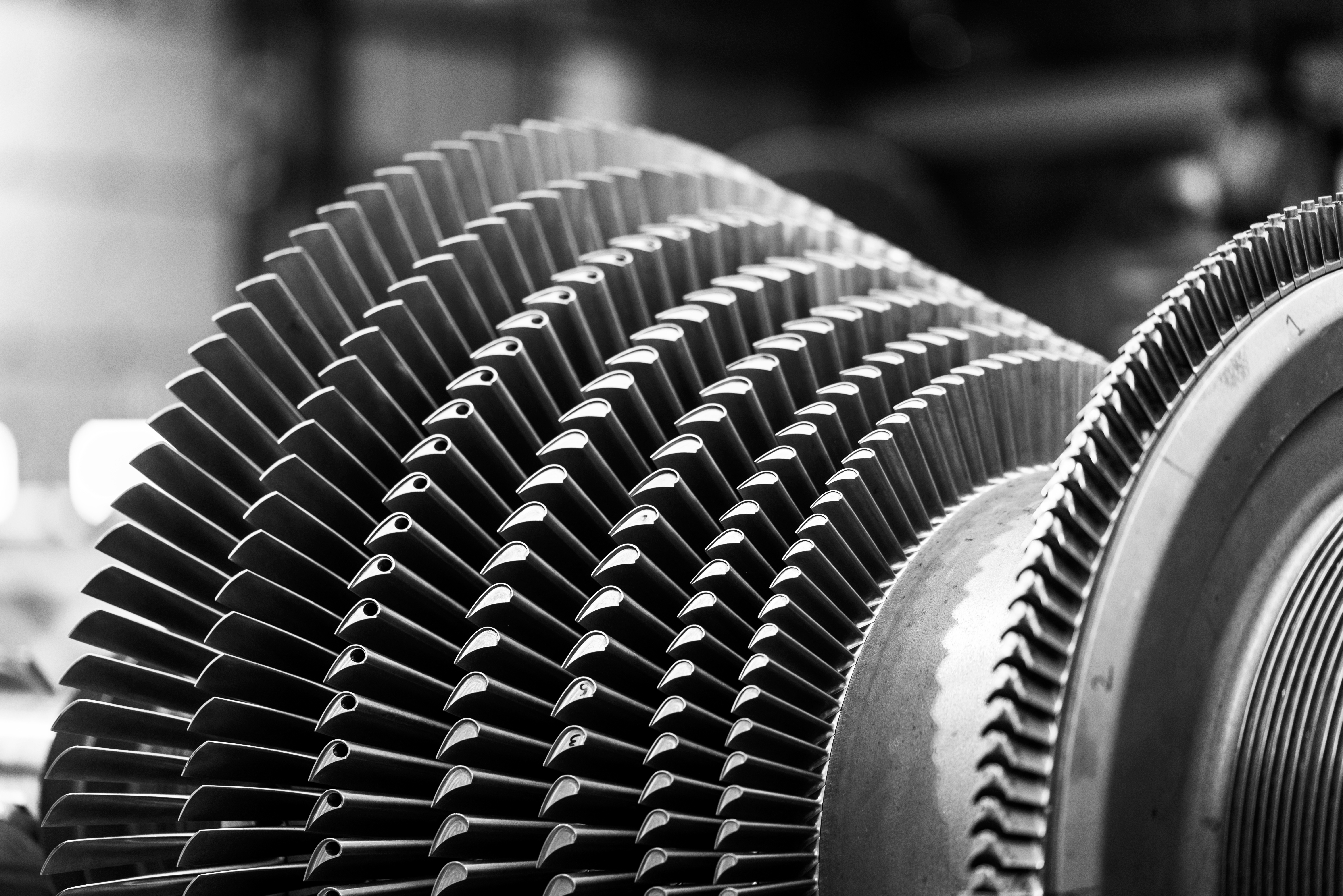 Black and white image of steam turbine rotor.
