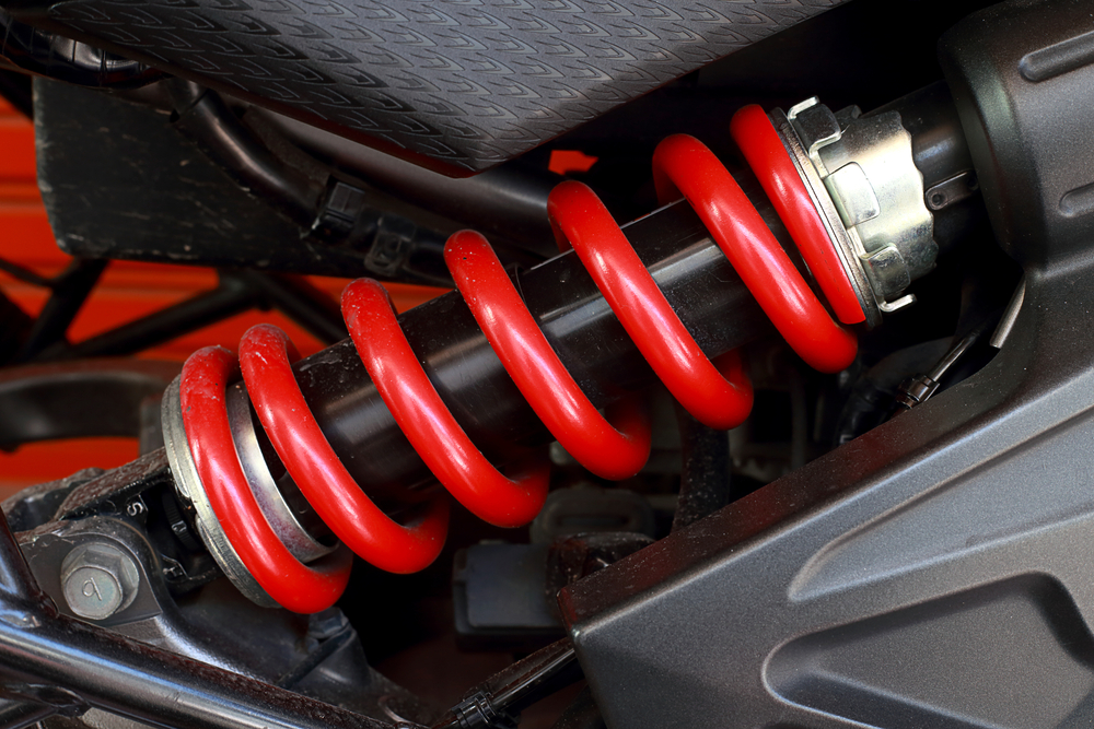 A cars red shock absorber springs 